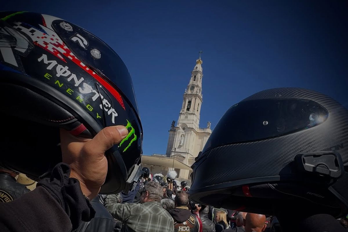 Helmets held aloft at the Blessing of the Helmets