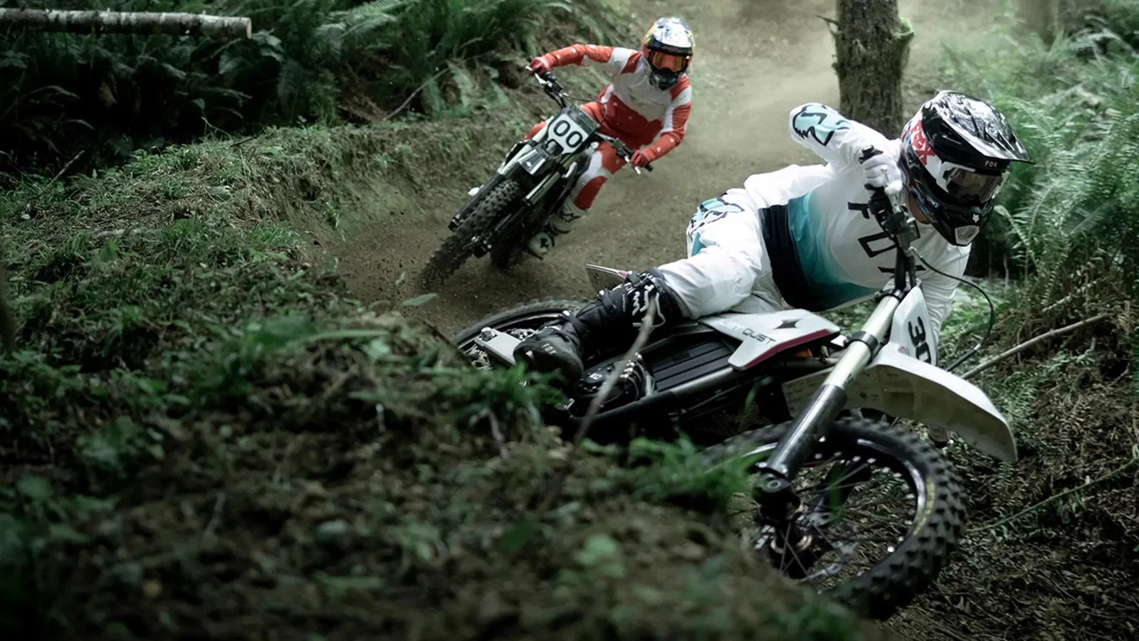 A dirst bike being ridden in woodland