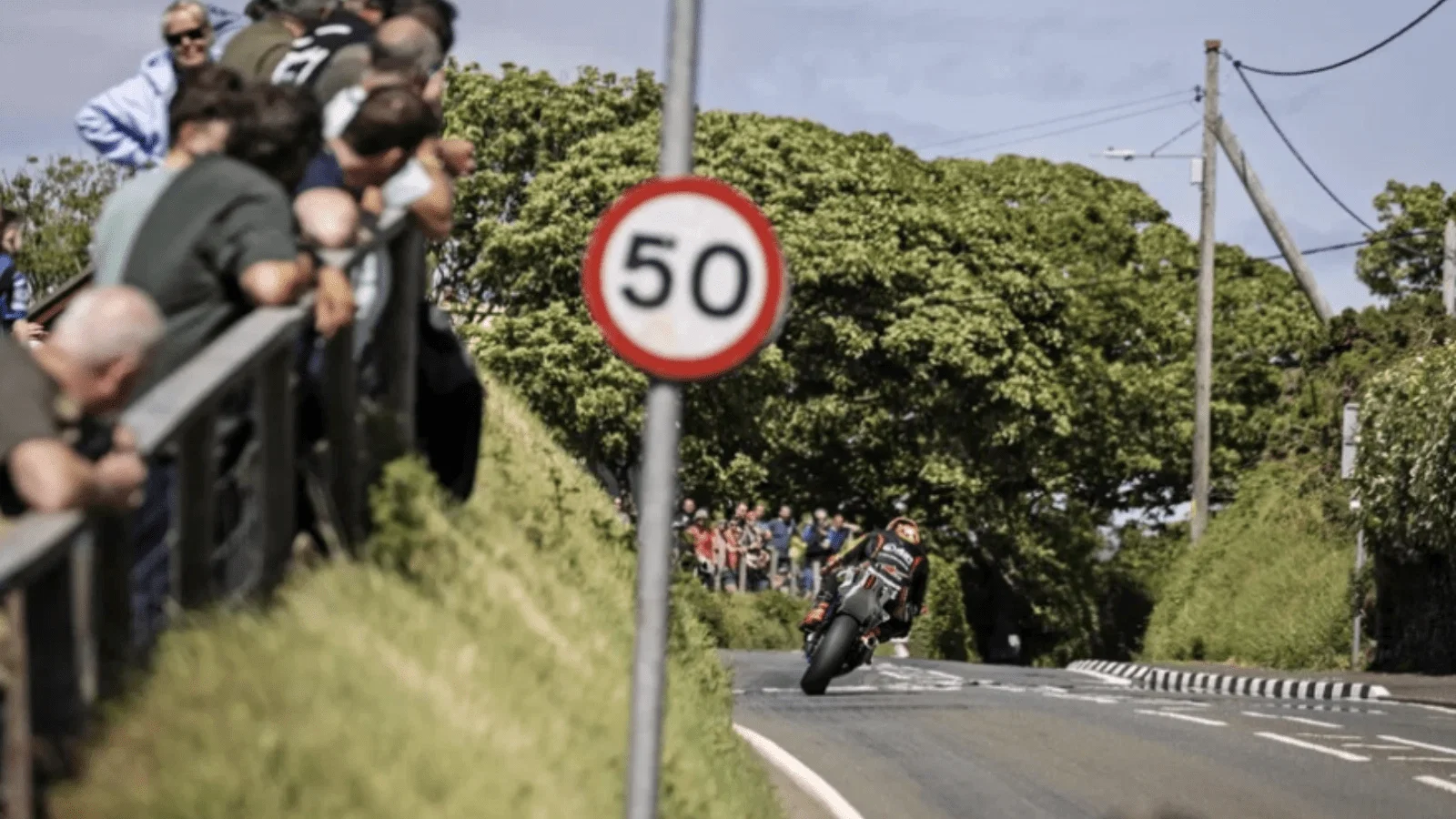 A rider and spectators at the TT. Credit: Isle of Man TT.