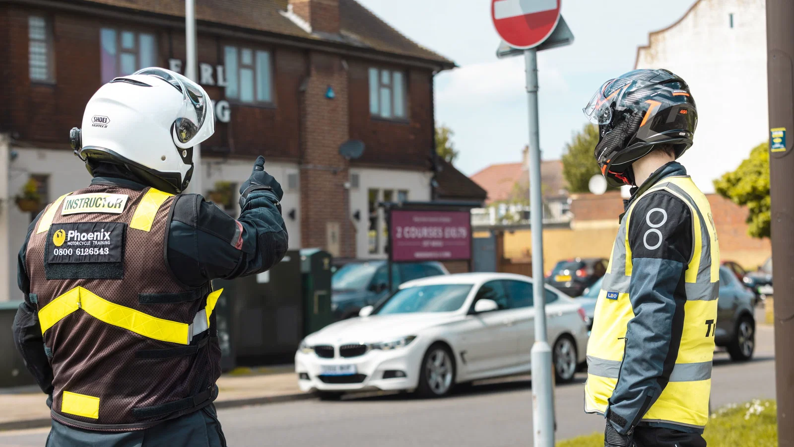 Motorcycle instructor teaching a learner rider