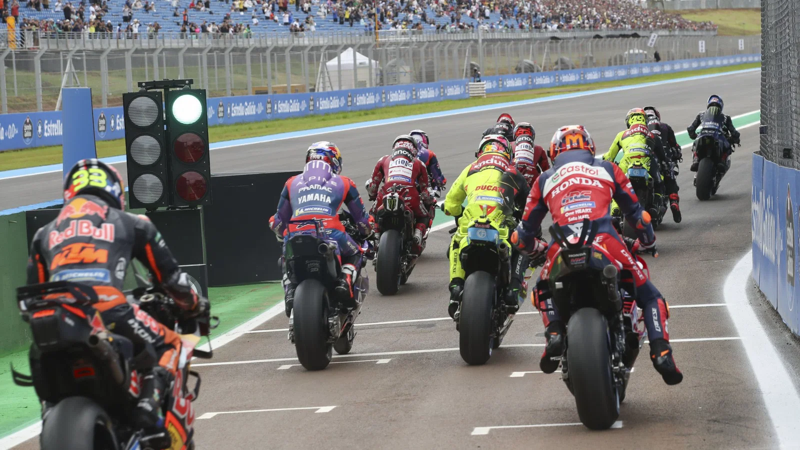 MotoGP riders exiting pit lane. Credit: Gold and Goose.