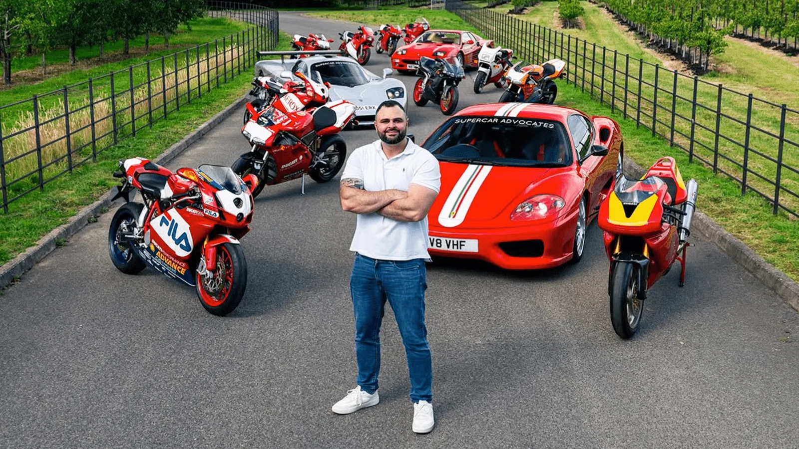 Lee Khouri standing with some of his two and four-wheel collection. Credit: Ducati.